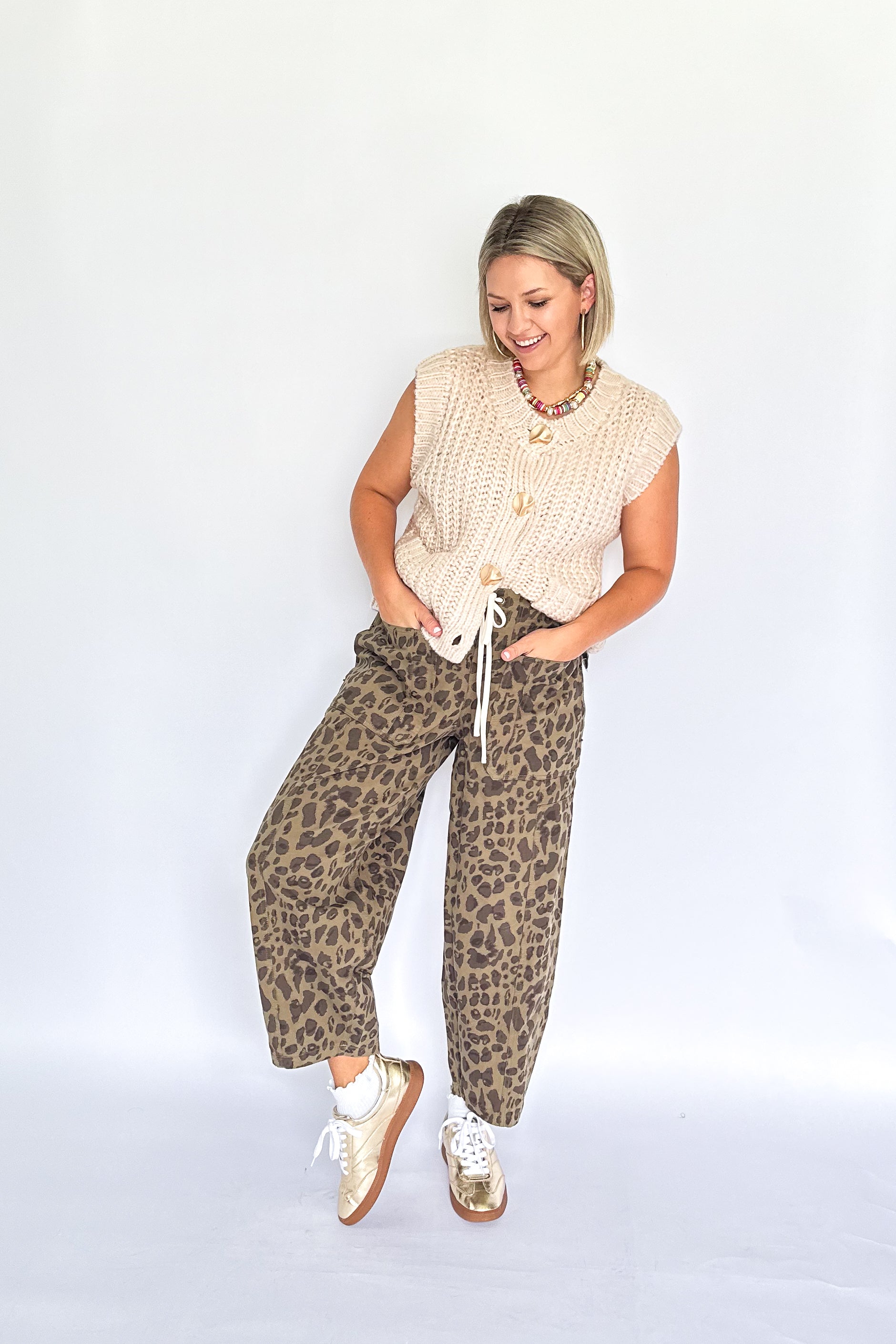 entro cream sleeveless sweater with gold buttons