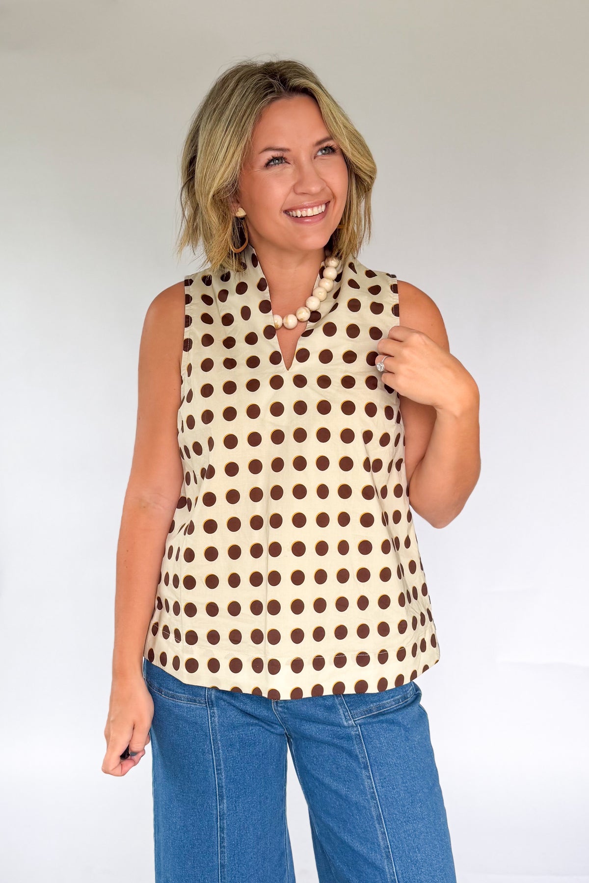 entro ivory tank top with brown polka dots